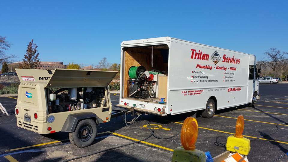 Photo of Tritan Services truck with gear on hitch